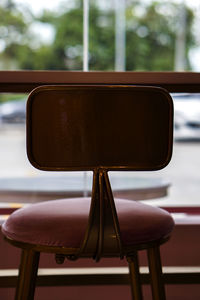 Close-up of empty chairs and table in restaurant