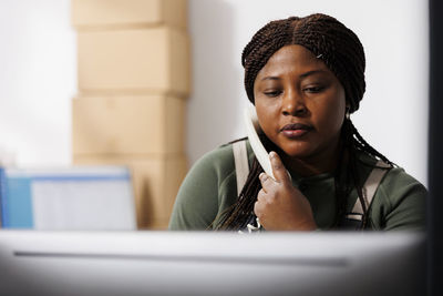 Portrait of young woman using mobile phone