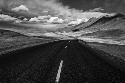 Road amidst landscape against sky