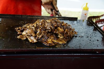 Close-up of meat on barbecue grill