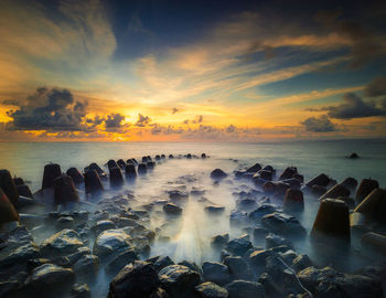 Scenic view of sea against sky during sunset