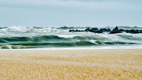 Scenic view of beach against sky