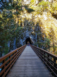 Rear view of person on footbridge