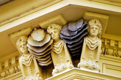 Low angle view of statues on building