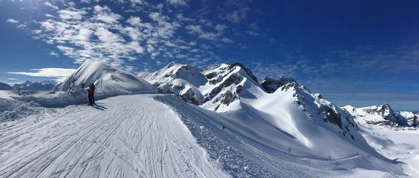 Panoramic view of snowcapped mountain against sky