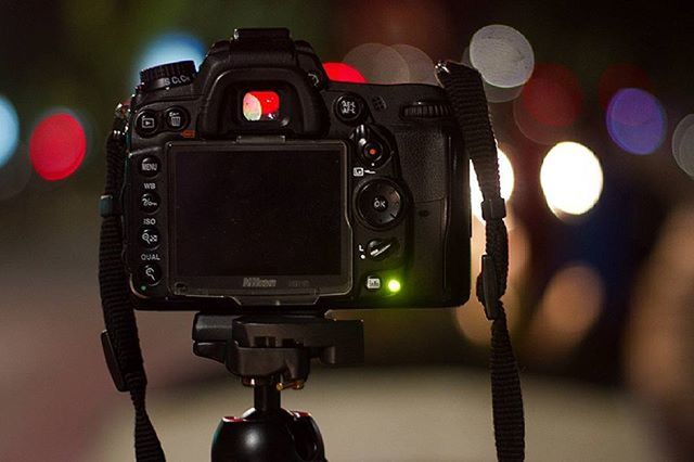 CLOSE-UP OF CAMERA WITH ELECTRIC LAMP