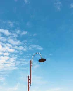 Low angle view of street light against sky