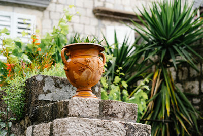 Close-up of stone on retaining wall in yard