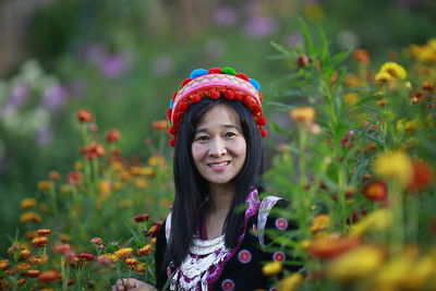 Portrait of smiling girl with flowers