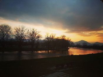 Scenic view of lake at sunset