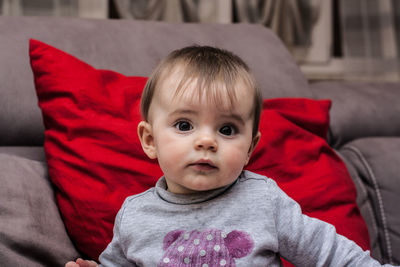 Portrait of cute baby girl at home