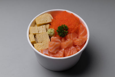 High angle view of chopped fruits in bowl on table