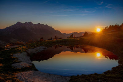 Scenic view of mountains against sky during sunset