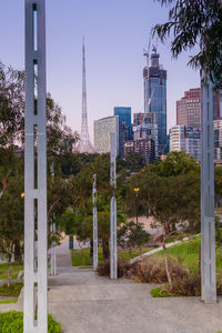 Street amidst buildings against clear sky