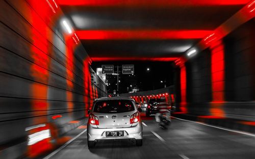 Cars moving on road in tunnel