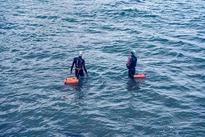 High angle view of people in sea
