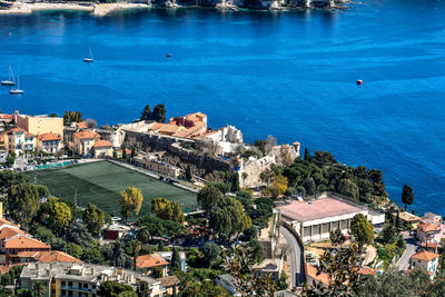 High angle view of town by sea