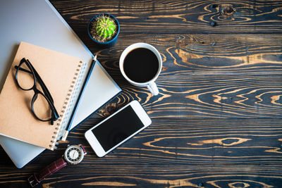 High angle view of coffee cup on table