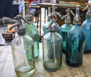 Close-up of empty bottles on table