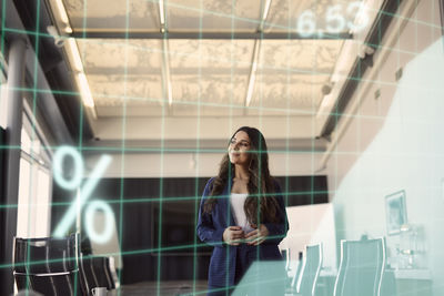 Businesswoman standing in conference room