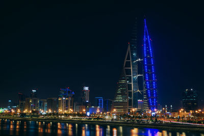 Illuminated city buildings at night