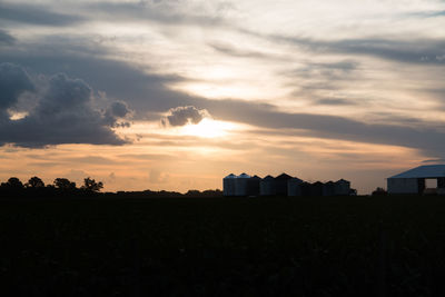 Scenic view of field against sky during sunset