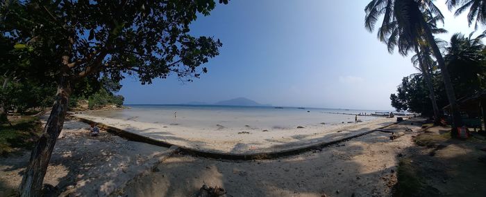 Scenic view of beach against clear sky
