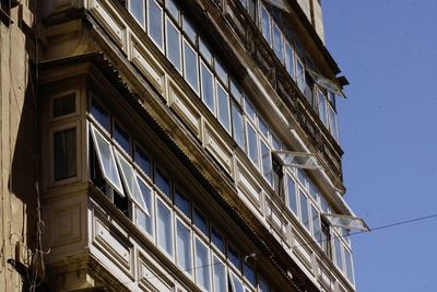 Low angle view of buildings against clear sky