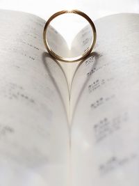 Close-up of heart shape on book