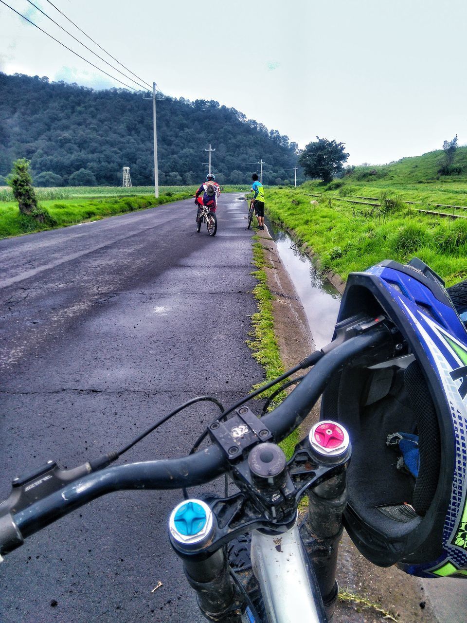 PERSON RIDING BICYCLE ON ROAD