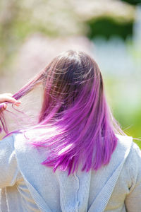 Rear view of woman with pink hair