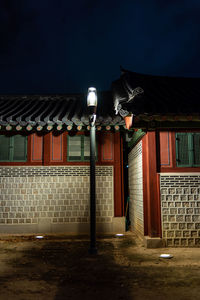 Illuminated building against sky at night