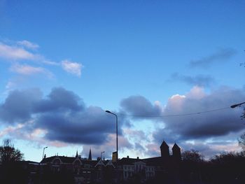 Low angle view of built structure against cloudy sky