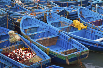 High angle view of boats moored at harbor