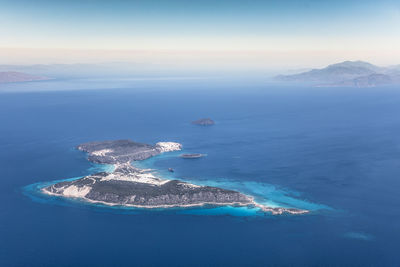 Aerial view of sea and island against sky