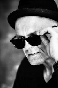 Close-up portrait of man wearing sunglasses