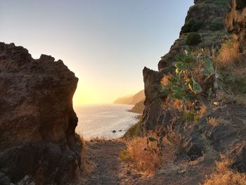 Scenic view of sea against clear sky during sunset