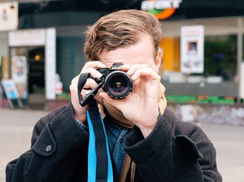 Portrait of man photographing