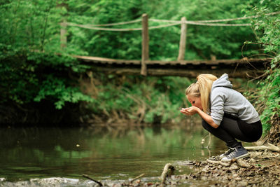 Side view of woman in lake