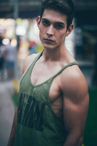 Portrait of young man standing outdoors