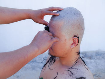 Barber shaving head of man