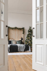 Beautiful interior of bedroom christmas open door