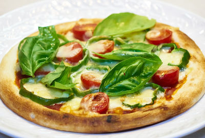 Close-up of homemade pizza served in plate