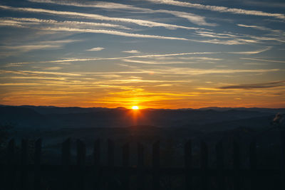 Scenic view of silhouette landscape against sky during sunset