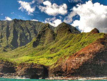 Scenic view of mountains against cloudy sky