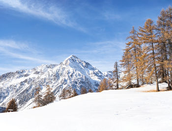 Scenic view of snowcapped mountains against sky