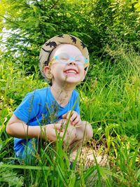 Portrait of smiling boy on field