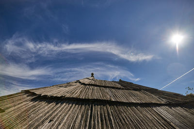 Low angle view of house against cloudy sky