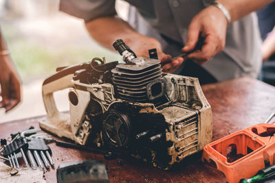 Close-up of man working on table