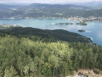 High angle view of trees by lake against sky